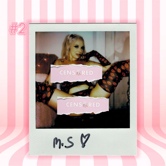 A Polaroid-style photo print centered on a pink striped background. The print shows a woman reclining in black and orange leopard-print stockings, with two torn pink labels reading 'CENSORED' over the image.