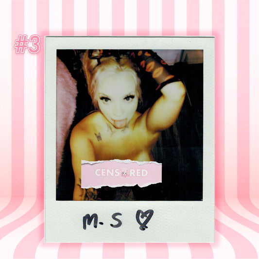 A Polaroid-style photo print centered on a pink striped background. The print shows a censored portrait of a woman with a torn pink label reading 'CENSORED' and handwritten text 'M.