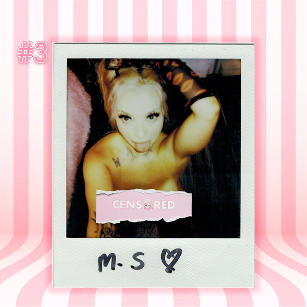 A Polaroid-style photo print centered on a pink striped background. The print shows a censored portrait of a woman with a torn pink label reading 'CENSORED' and handwritten text 'M.