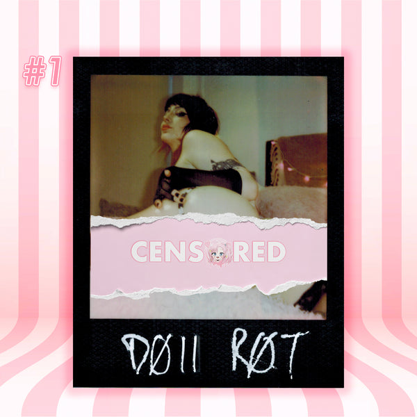 A stylized Polaroid-style photo print with a black border, showing a censored bedroom scene with a person and a cat, overlaid with a pink torn-paper band reading 'CENSORED' and white handwritten text at the bottom. The print is centered on a pink-and-white striped background with '#1' in the top left.